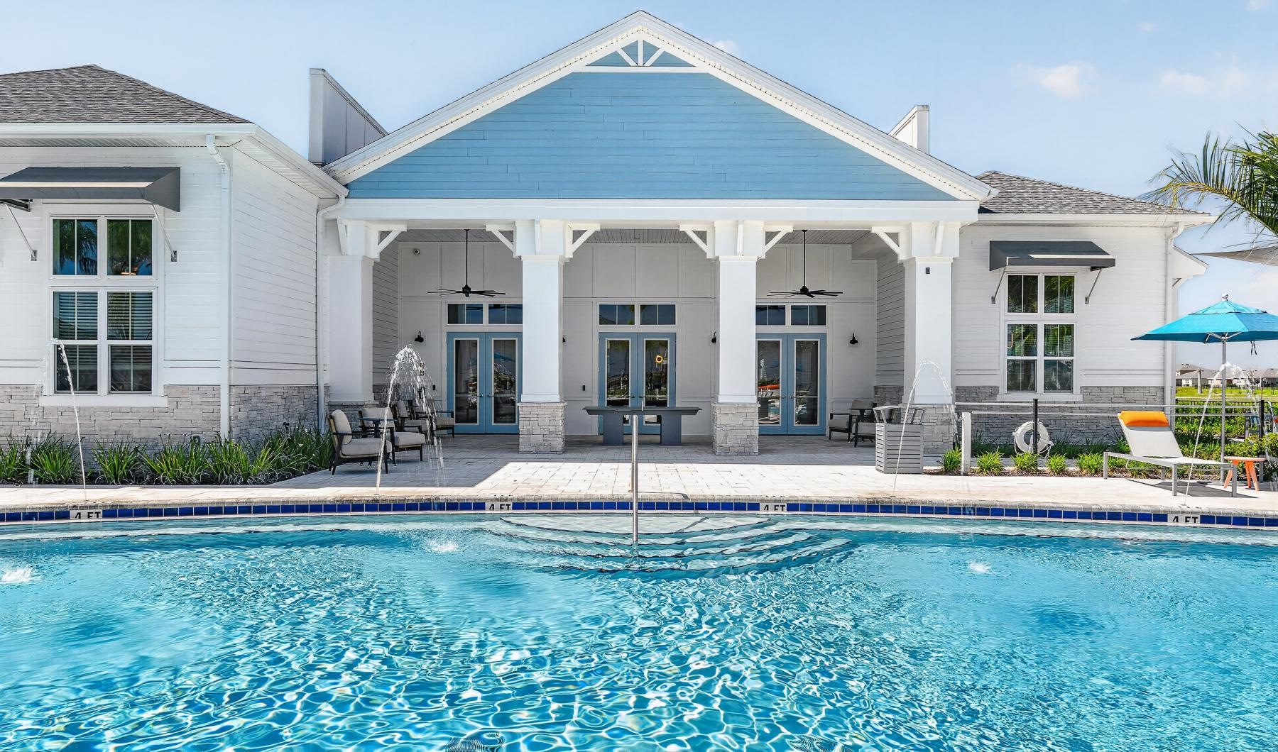 a swimming pool in front of a house