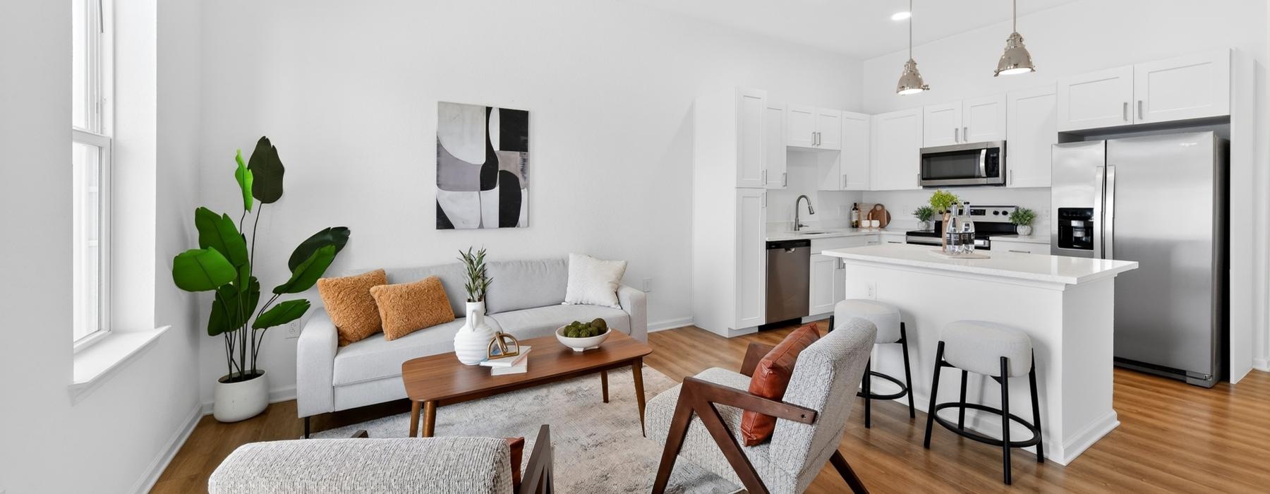 a living room with a table and chairs