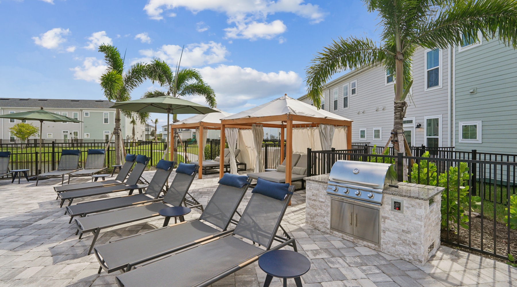 Pool Deck with Loungers, Cabanas and Grill